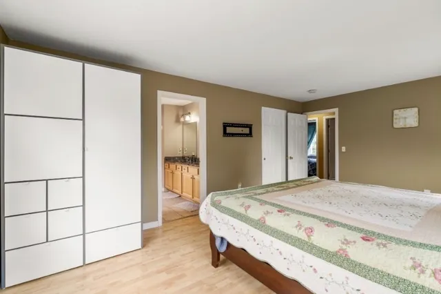 a bedroom with a bed and a dresser