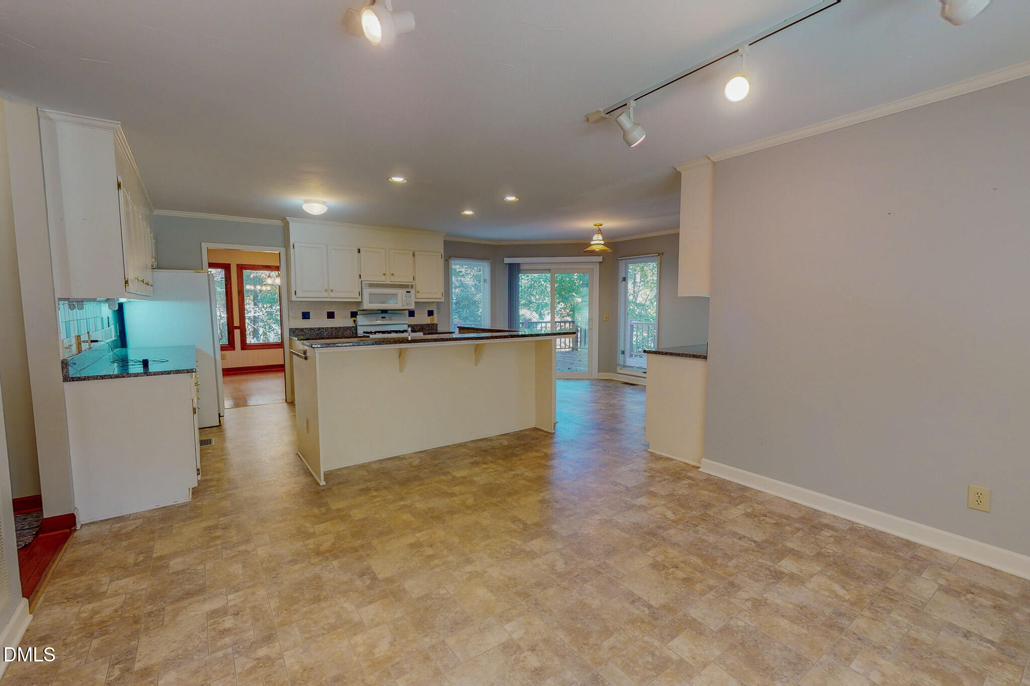 11 Denada Path Roxboro, NC 27574 - Photo 12 of 62 a view of a kitchen with kitchen island wooden floors and stainless steel appliances