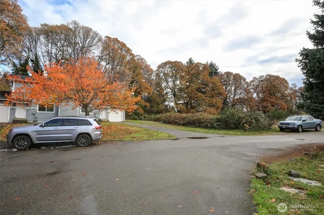 a view of street with parked cars