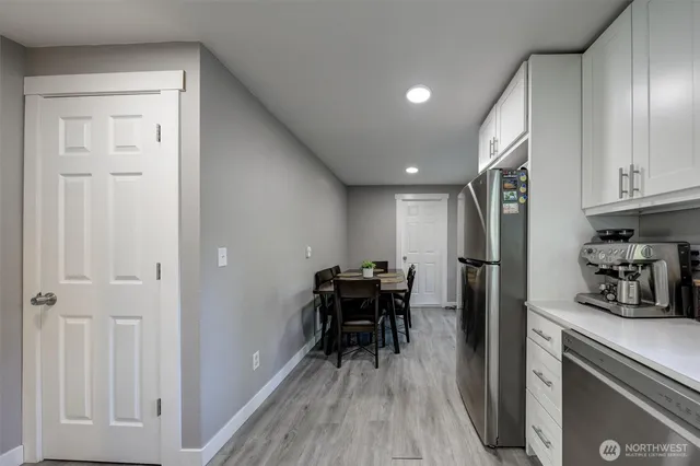 a kitchen with a table and chairs