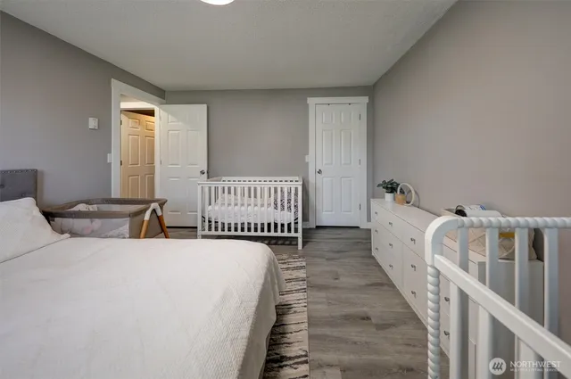 a bedroom with bed and a window