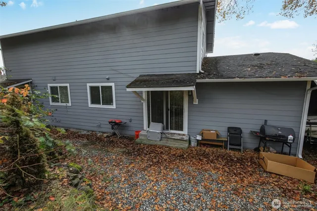 a backyard of a house with seating space