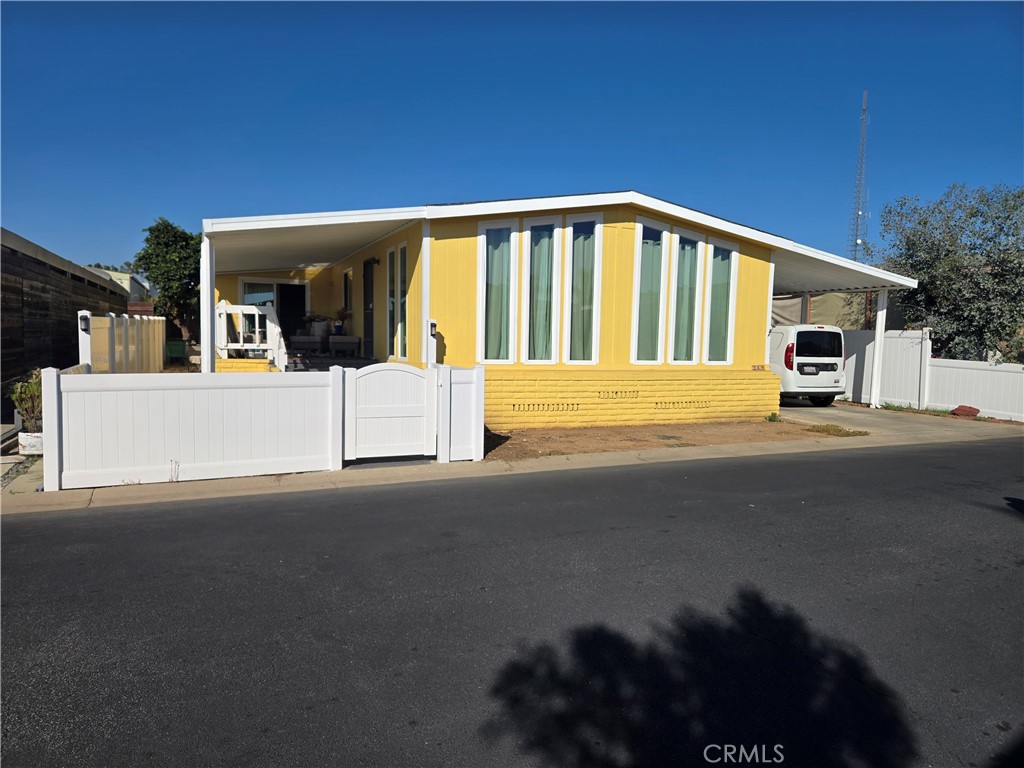 a front view of a house with a street