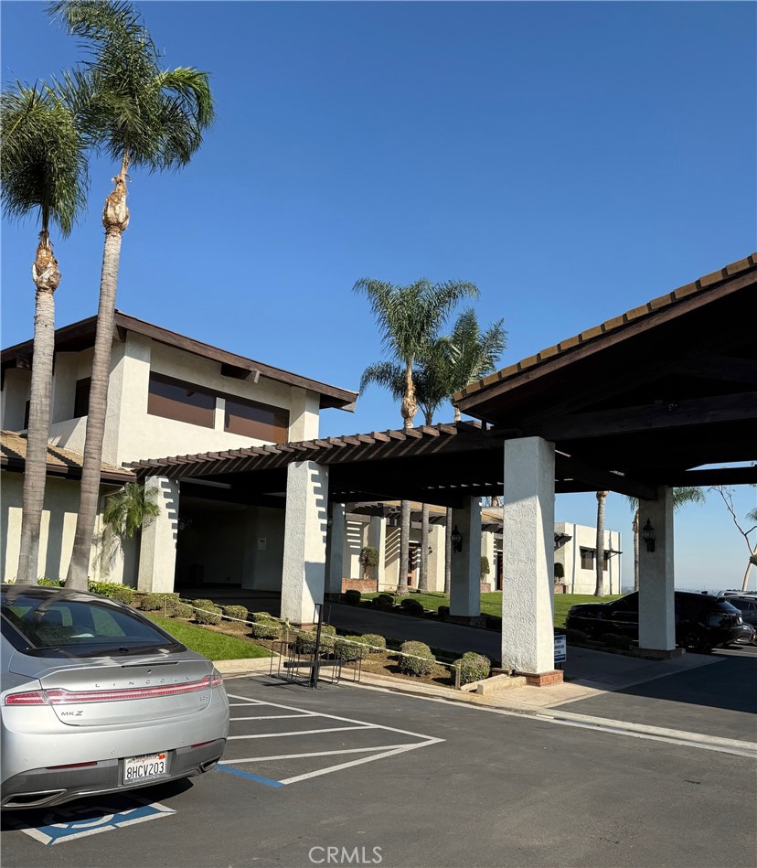 19009 South Laurel Park Road, Unit 248 Rancho Dominguez, CA 90220 - Photo 16 of 20 a view of a building with a patio