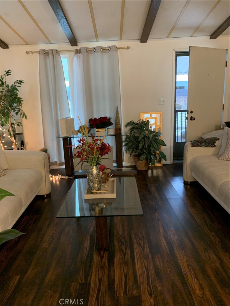 19009 South Laurel Park Road, Unit 248 Rancho Dominguez, CA 90220 - Photo 2 of 20 a living room with furniture and a wooden floor