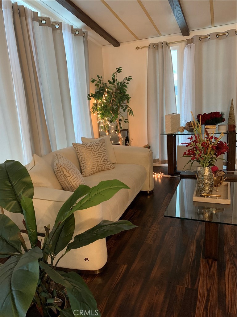 19009 South Laurel Park Road, Unit 248 Rancho Dominguez, CA 90220 - Photo 3 of 20 a living room with furniture and a floor to ceiling window