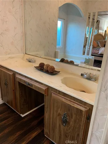a bathroom with a sink and a mirror