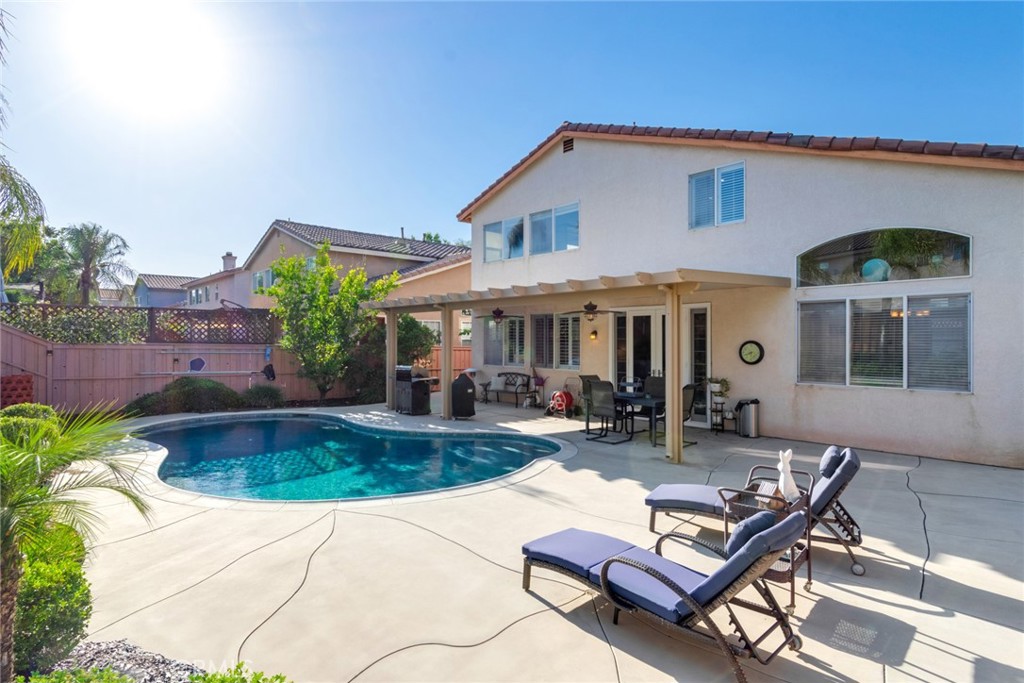 20885 Bakal Drive Riverside, CA 92508 - Photo 30 of 47 a view of a house with swimming pool and sitting area