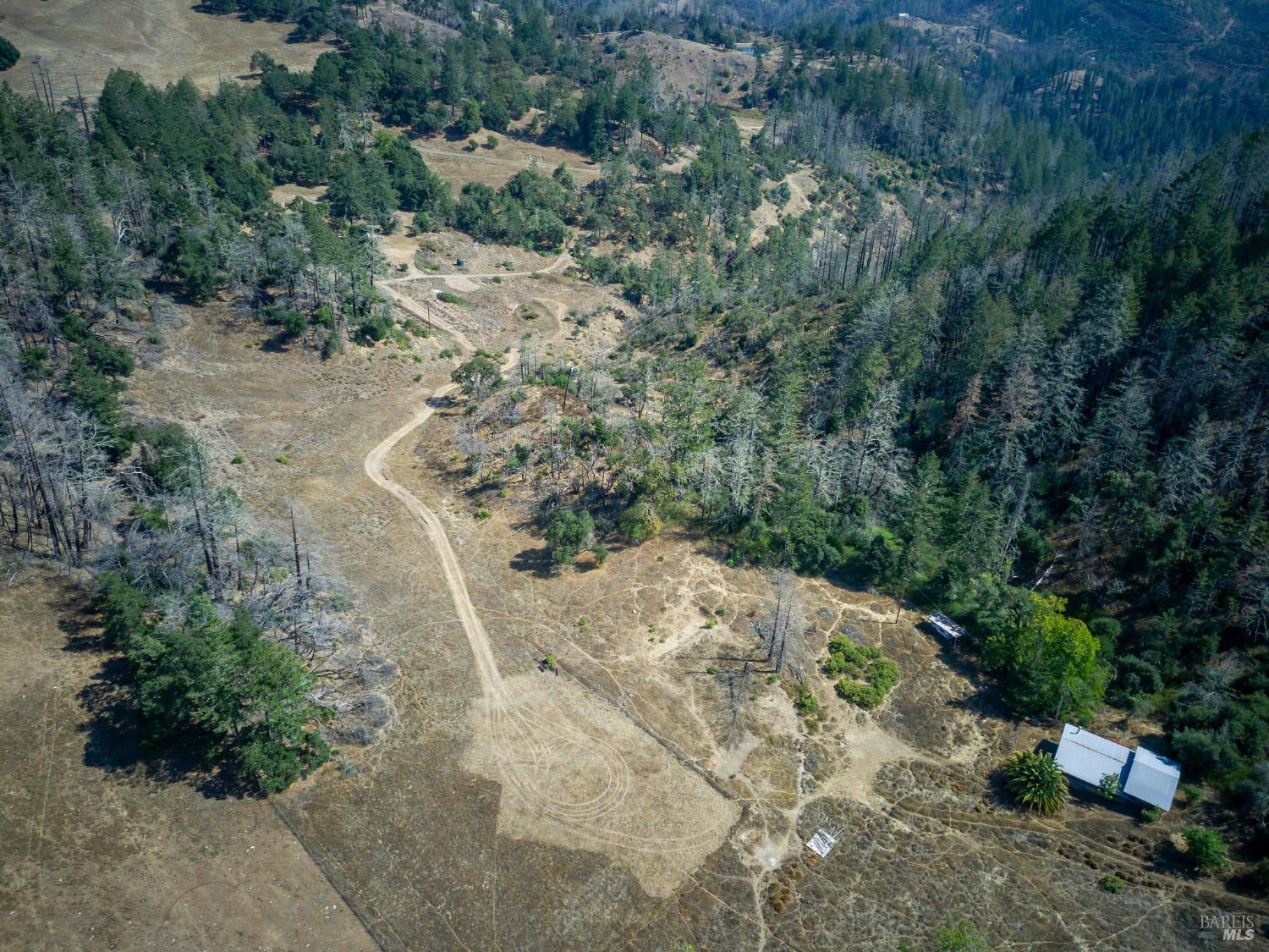 6583 St Helena Road Santa Rosa, CA 95404 - Photo 68 of 71 a view of a dry yard with wooden fence
