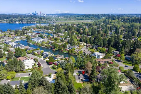 an aerial view of a city and lake view