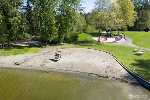 a view of a swimming pool with a yard