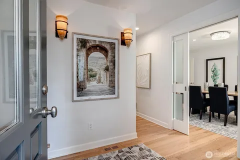 a view of a hallway view with wooden floor and staircase