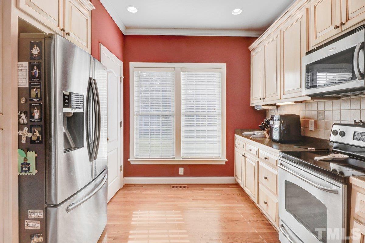 2899 Benson Hardee Road Benson, NC 27504 - Photo 15 of 31 a kitchen with stainless steel appliances granite countertop a refrigerator a stove and a sink
