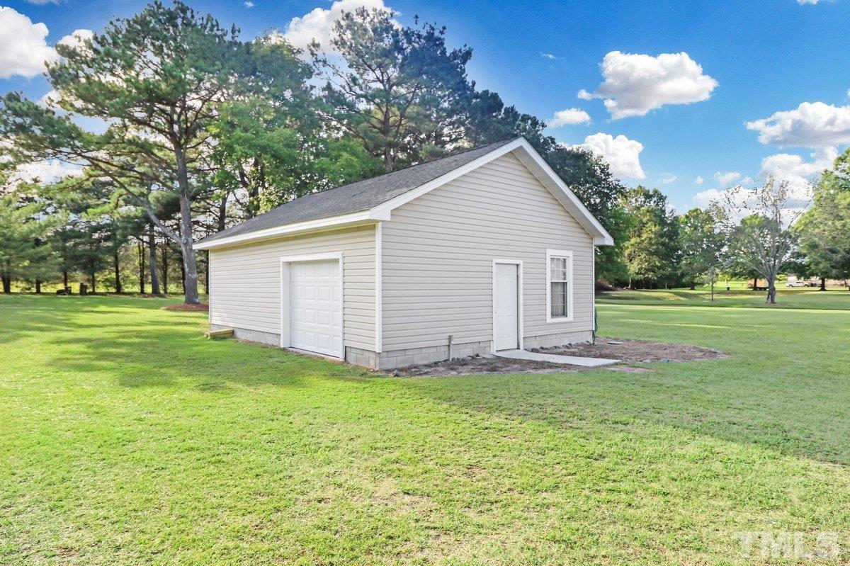 2899 Benson Hardee Road Benson, NC 27504 - Photo 22 of 31 a view of a house with backyard