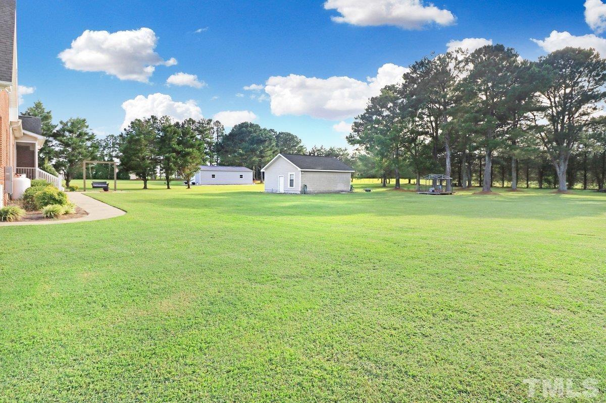 2899 Benson Hardee Road Benson, NC 27504 - Photo 23 of 31 a view of a big yard and an ocean view