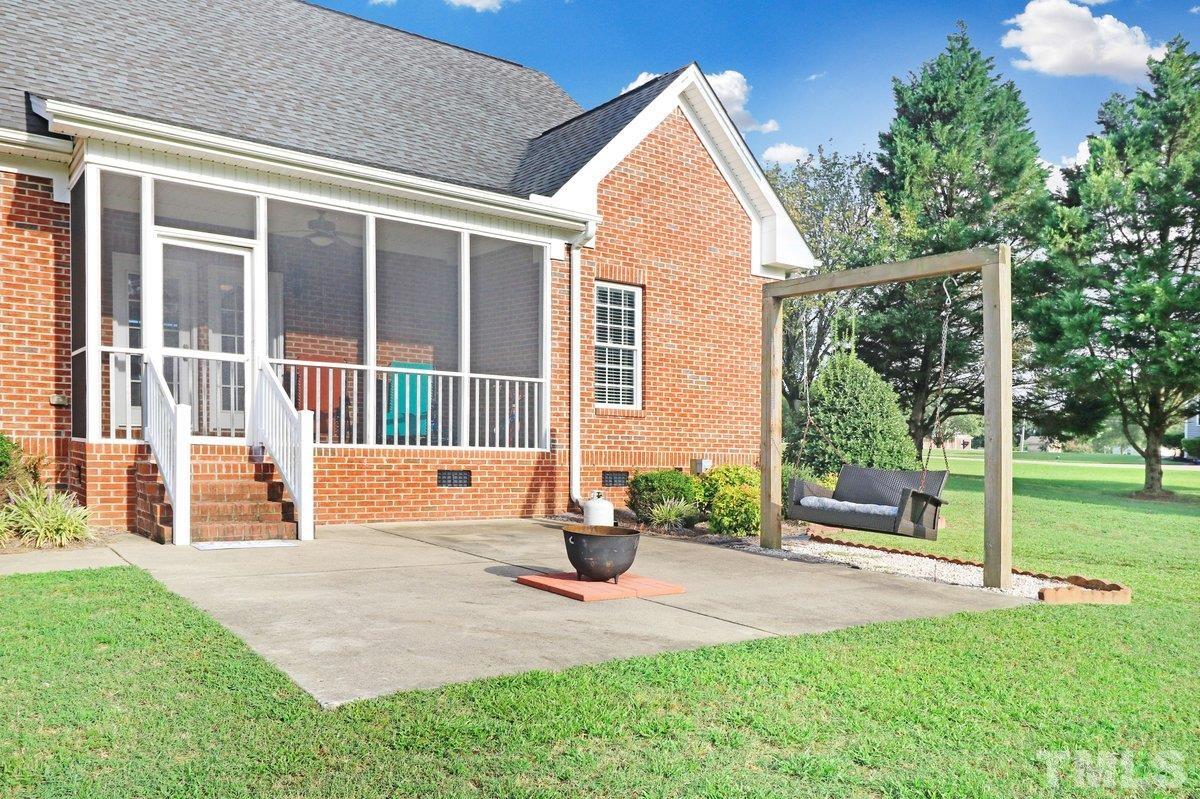2899 Benson Hardee Road Benson, NC 27504 - Photo 24 of 31 a view of a house with backyard and sitting area