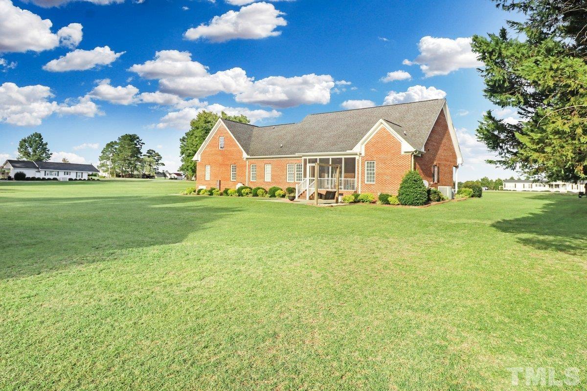 2899 Benson Hardee Road Benson, NC 27504 - Photo 25 of 31 a view of a house with a big yard