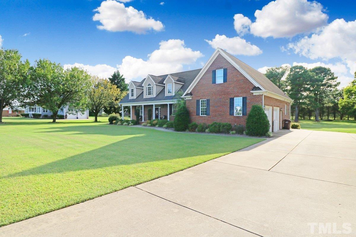 2899 Benson Hardee Road Benson, NC 27504 - Photo 29 of 31 a front view of house with yard and green space
