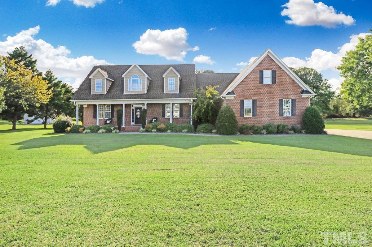 2899 Benson Hardee Road Benson, NC 27504 - Photo 30 of 31 a front view of a house with yard and green space