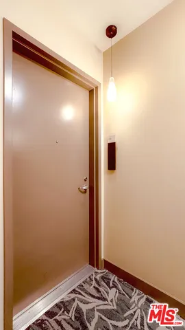 a kitchen with stainless steel appliances granite countertop a refrigerator a stove and a microwave