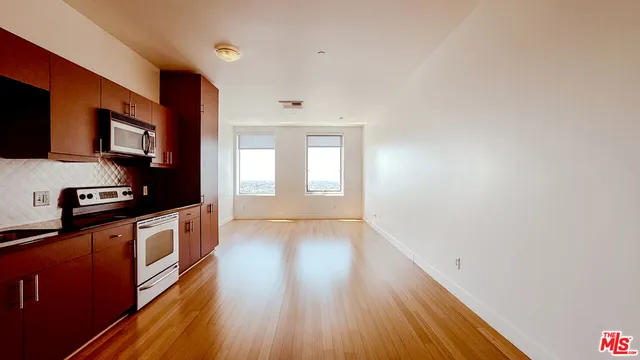 a view of a bathroom with a tub and mirror