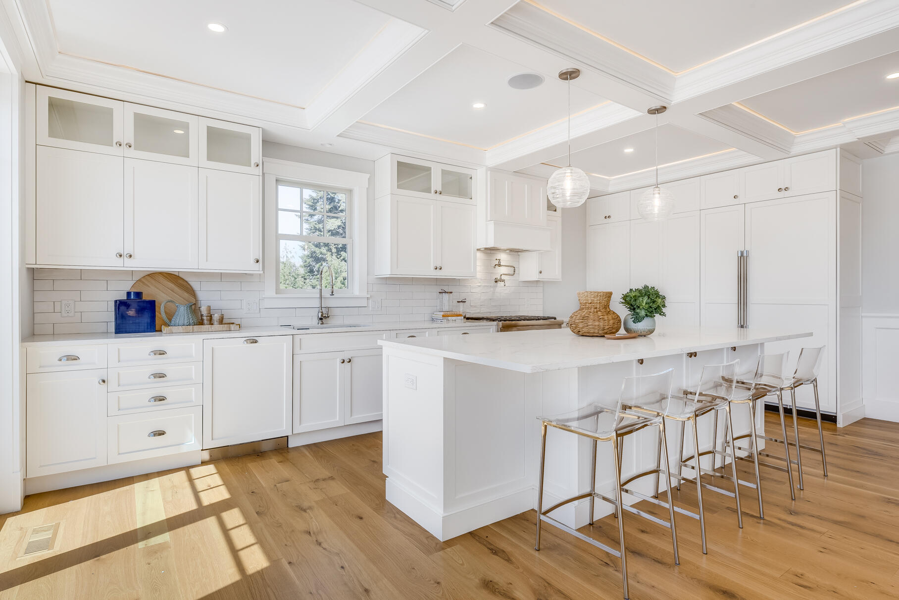159 Sesuit Neck Road East Dennis, MA 02641 - Photo 19 of 78 a kitchen with white cabinets and wooden floor