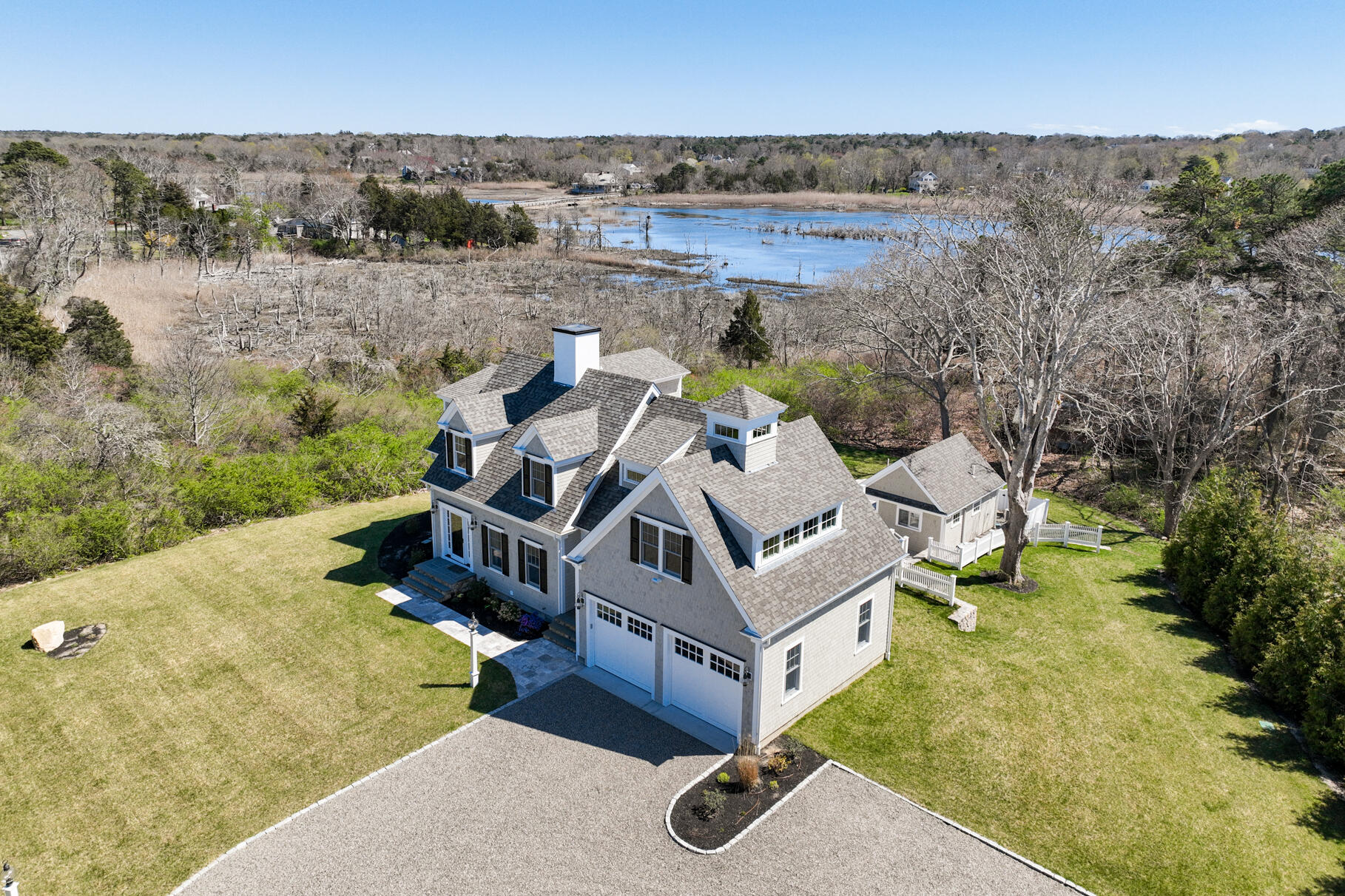 159 Sesuit Neck Road East Dennis, MA 02641 - Photo 2 of 78 an aerial view of a house with swimming pool and mountain view