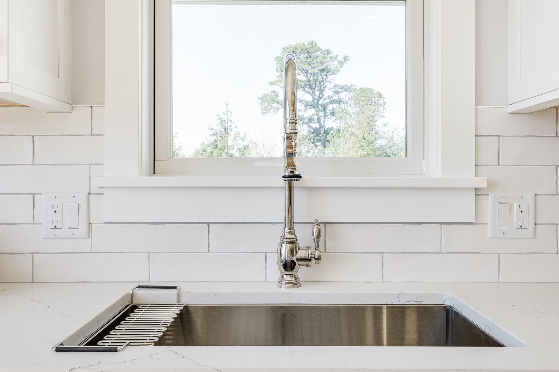 159 Sesuit Neck Road East Dennis, MA 02641 - Photo 22 of 78 a kitchen with a sink and a window