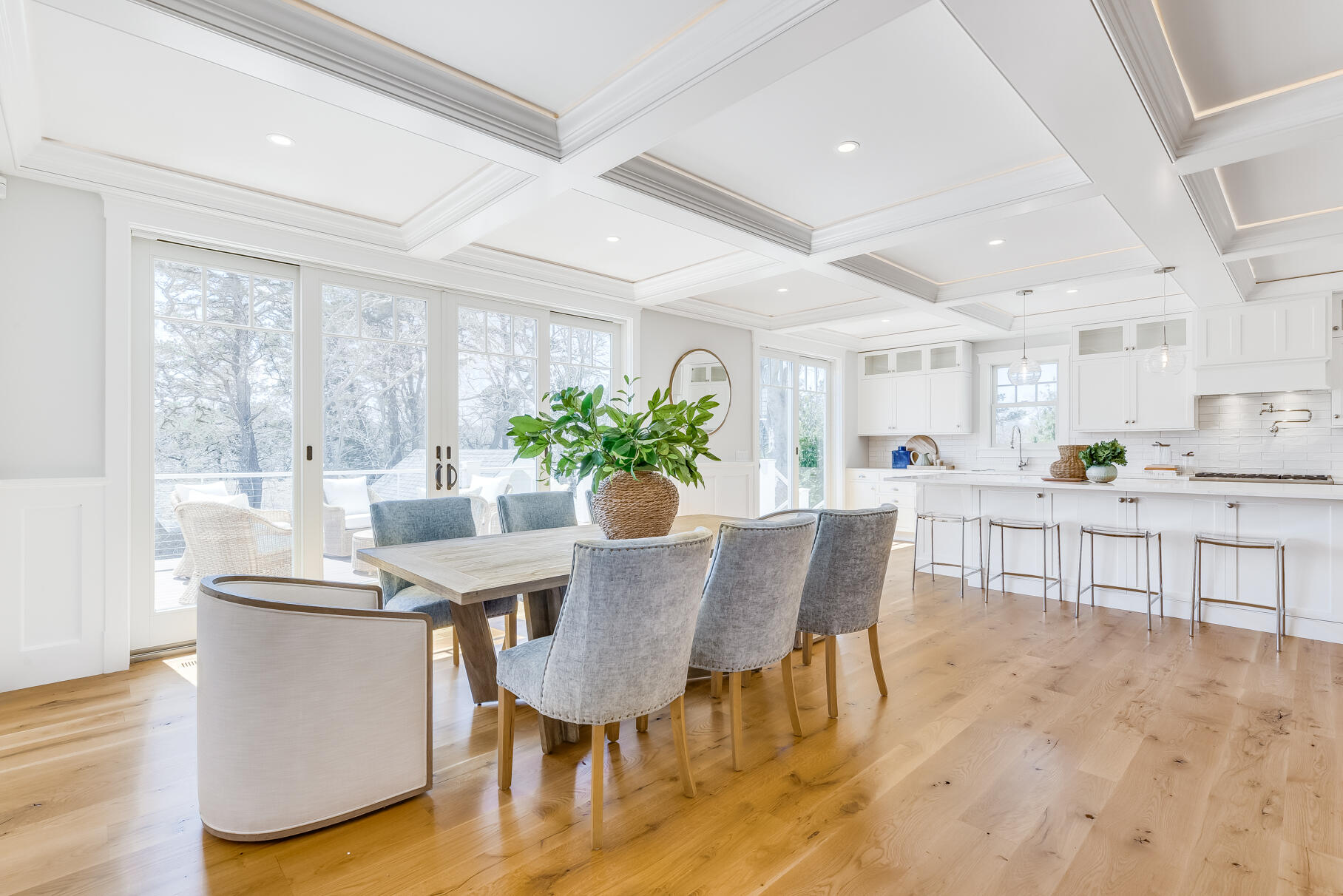 159 Sesuit Neck Road East Dennis, MA 02641 - Photo 26 of 78 a view of a dining room with furniture and a potted plant