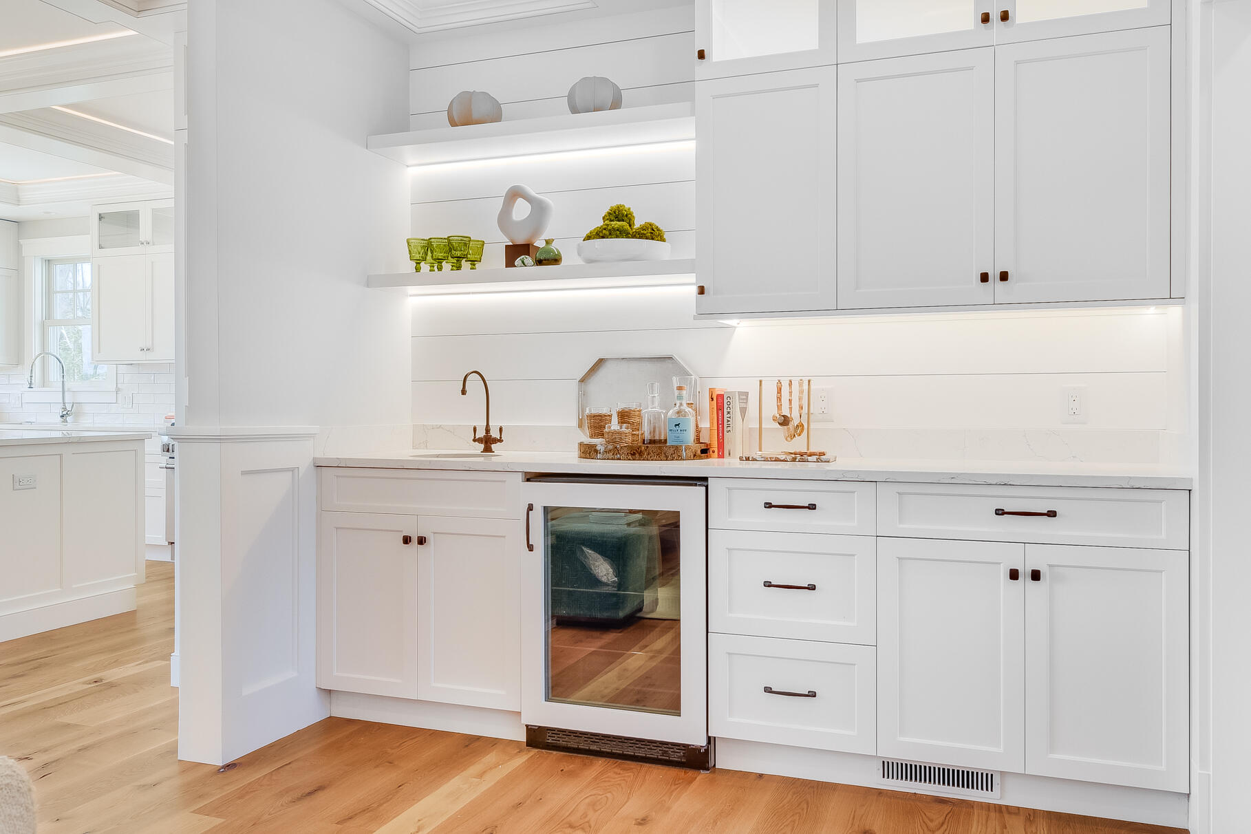 159 Sesuit Neck Road East Dennis, MA 02641 - Photo 30 of 78 a kitchen with white cabinets and a wooden floor