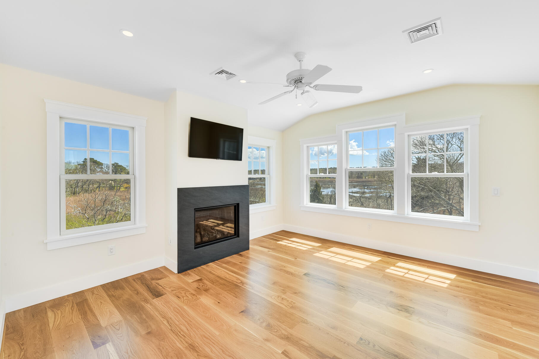 159 Sesuit Neck Road East Dennis, MA 02641 - Photo 43 of 78 a view of an empty room with a window and a fireplace