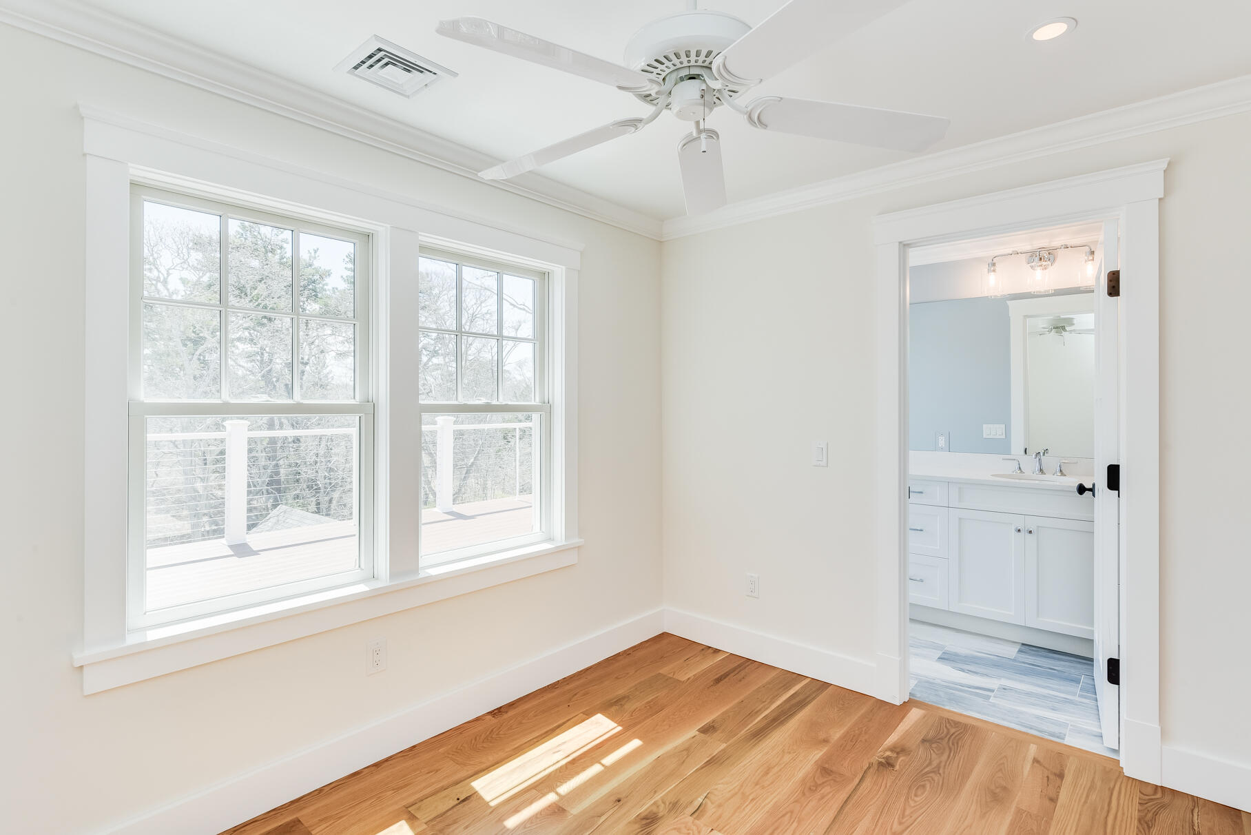 159 Sesuit Neck Road East Dennis, MA 02641 - Photo 45 of 78 a view of empty room with wooden floor and fan