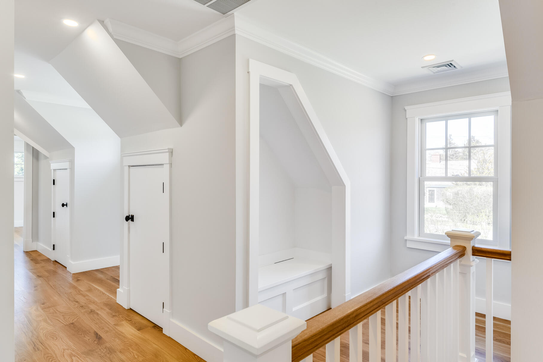 159 Sesuit Neck Road East Dennis, MA 02641 - Photo 46 of 78 a view of a hallway with windows and stairs