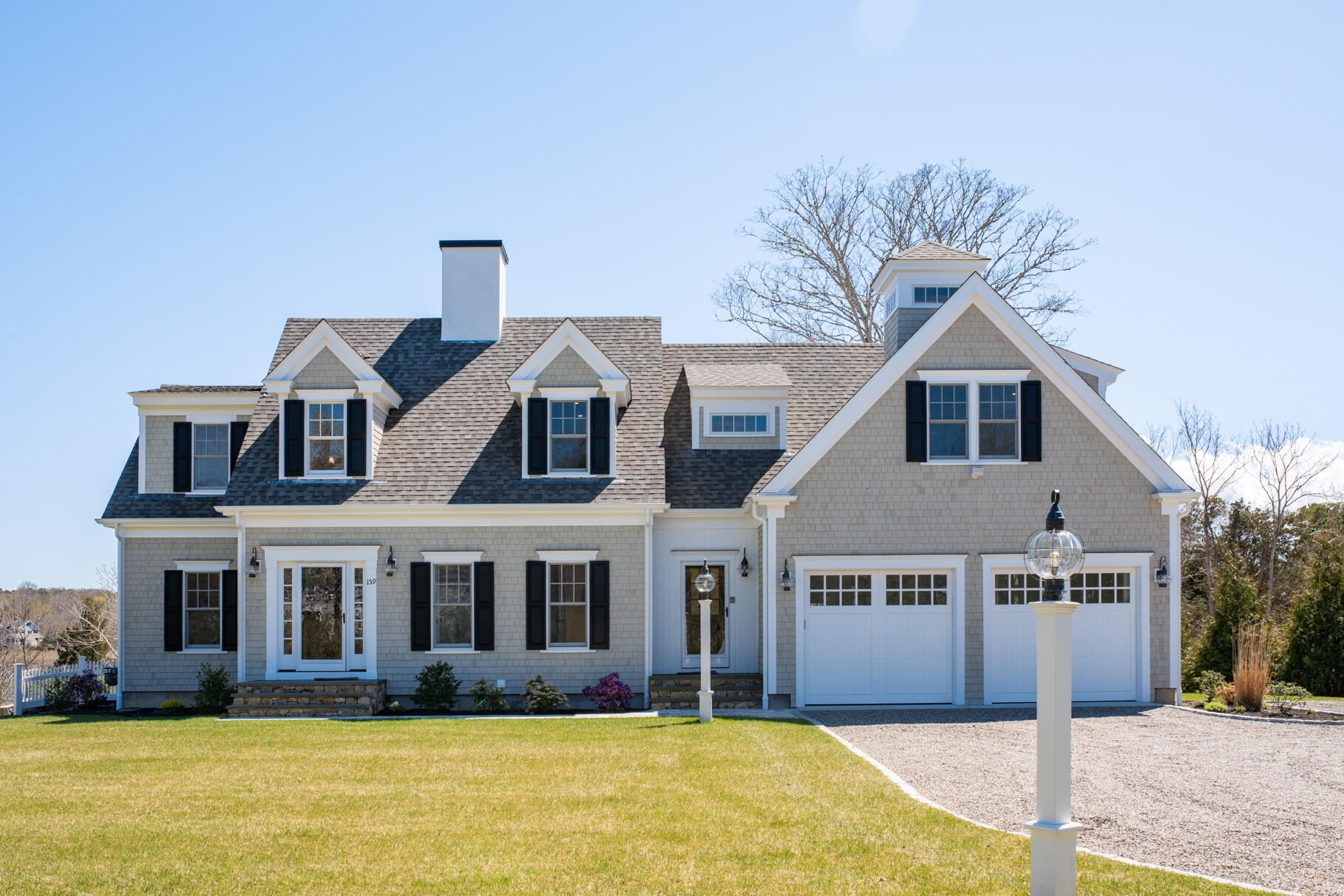 159 Sesuit Neck Road East Dennis, MA 02641 - Photo 67 of 78 a front view of house with yard and trees around