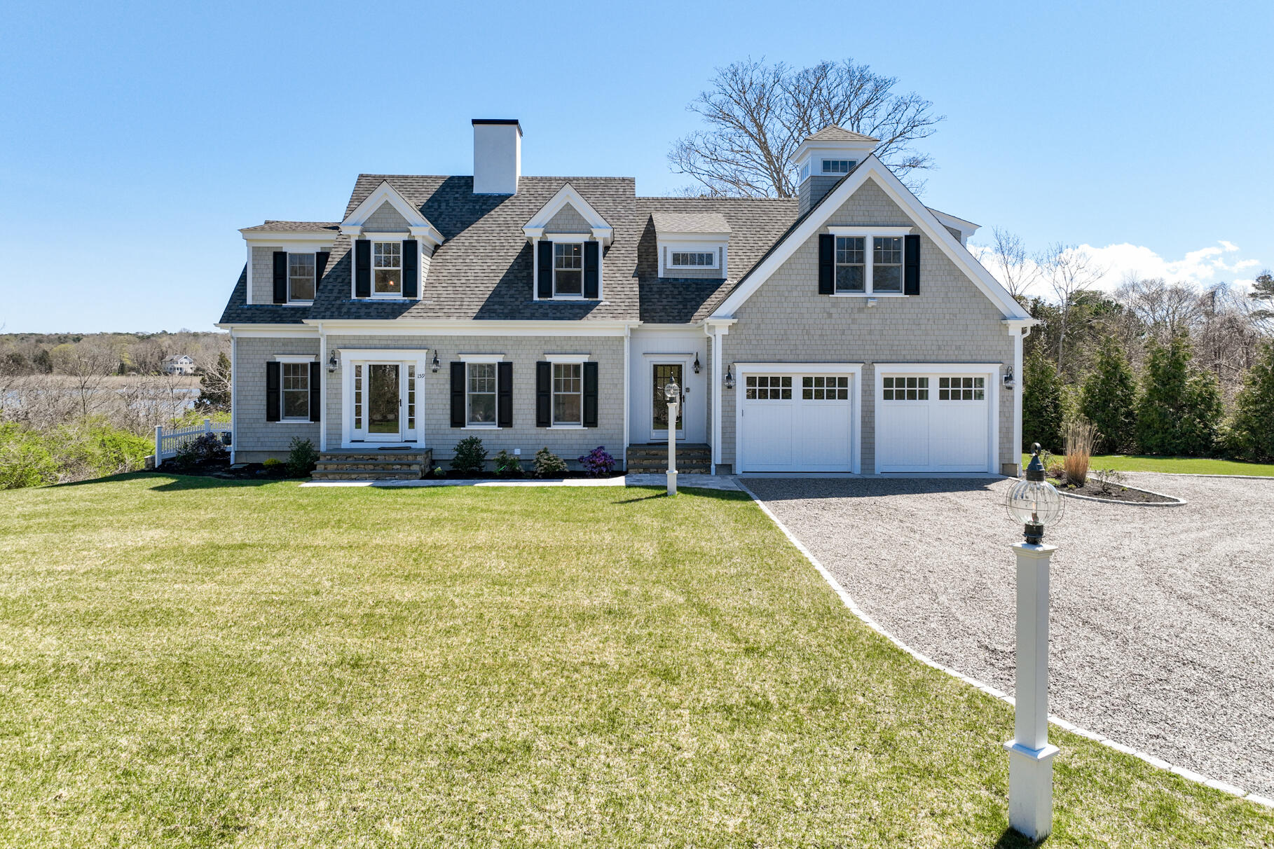159 Sesuit Neck Road East Dennis, MA 02641 - Photo 78 of 78 a front view of a house with a yard