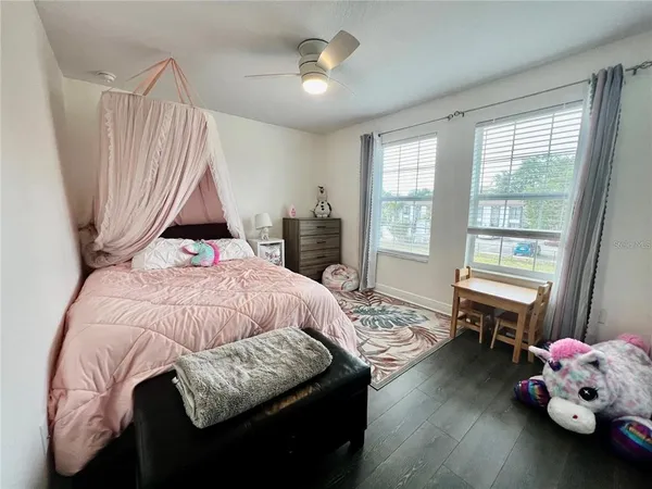 a bed room with a bed and a window