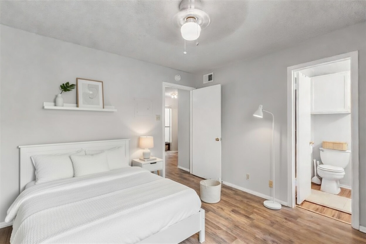 3115 Helms Street, Unit 210 Austin, TX 78705 - Photo 4 of 17 a bedroom with a bed and a window