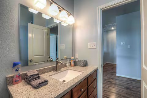 3523 Charleston Street Houston, TX 77021 - Photo 16 of 17 a bathroom with a granite countertop sink and a mirror