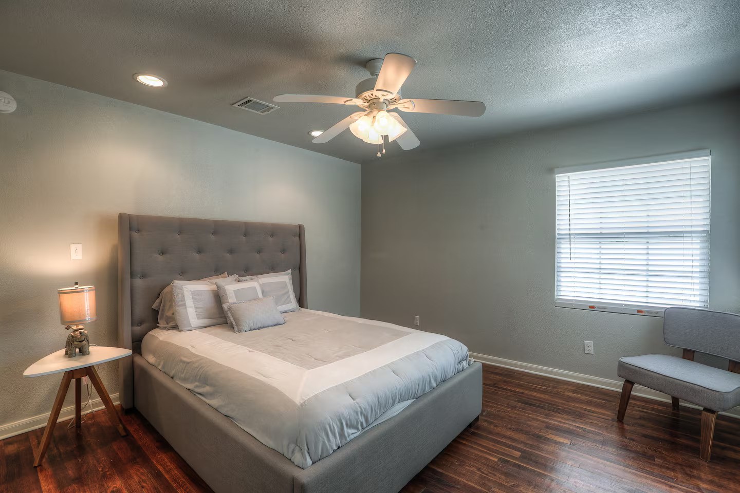 3523 Charleston Street Houston, TX 77021 - Photo 2 of 17 a bedroom with a bed and a chandelier