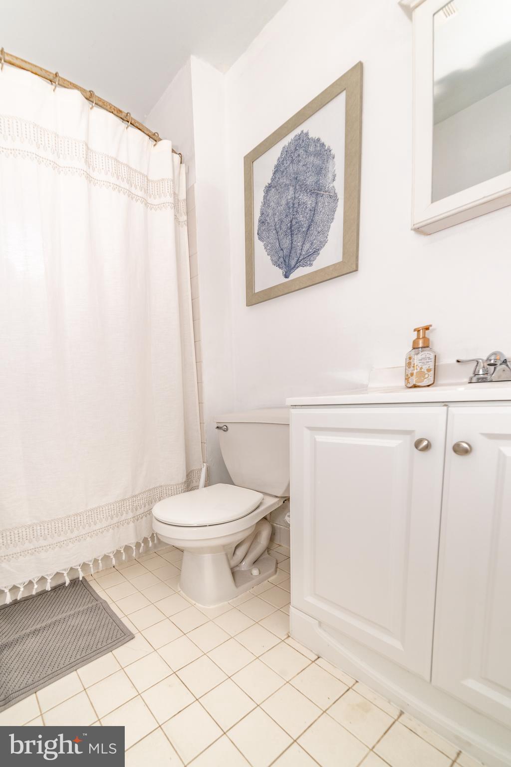 811 Pine Road Wallingford, PA 19086 - Photo 25 of 41 a bathroom with a toilet a sink and a shower