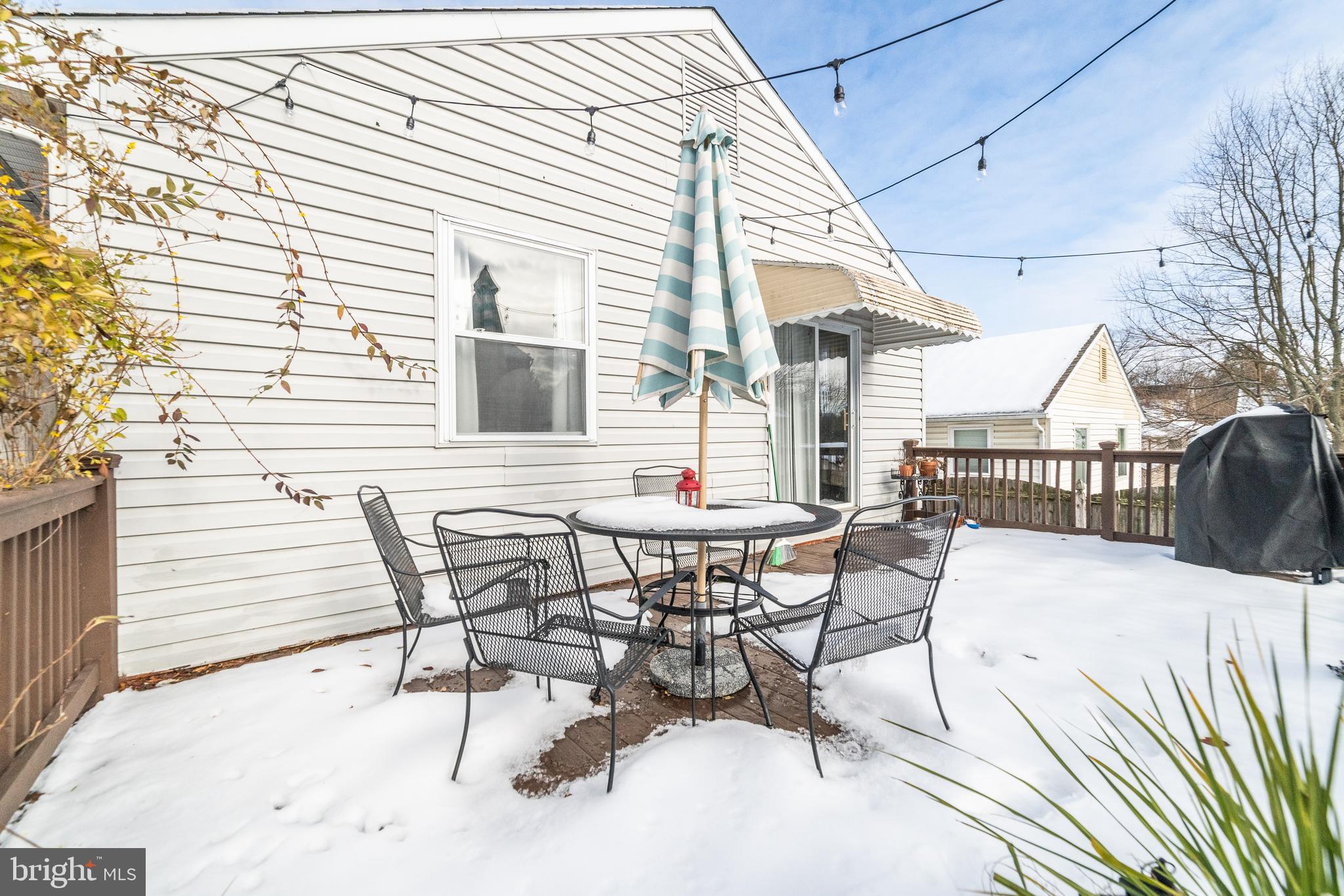 811 Pine Road Wallingford, PA 19086 - Photo 37 of 41 a view of a patio with table and chairs and wooden floor