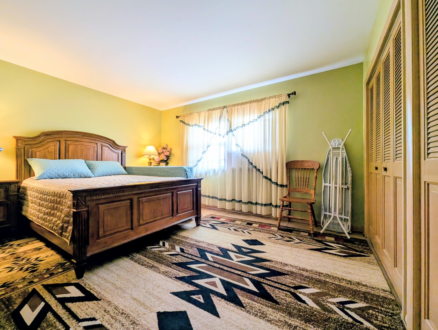 4229 North Keystone Avenue, Unit 3H Chicago, IL 60641 - Photo 15 of 22 a bedroom with a bed next to a window