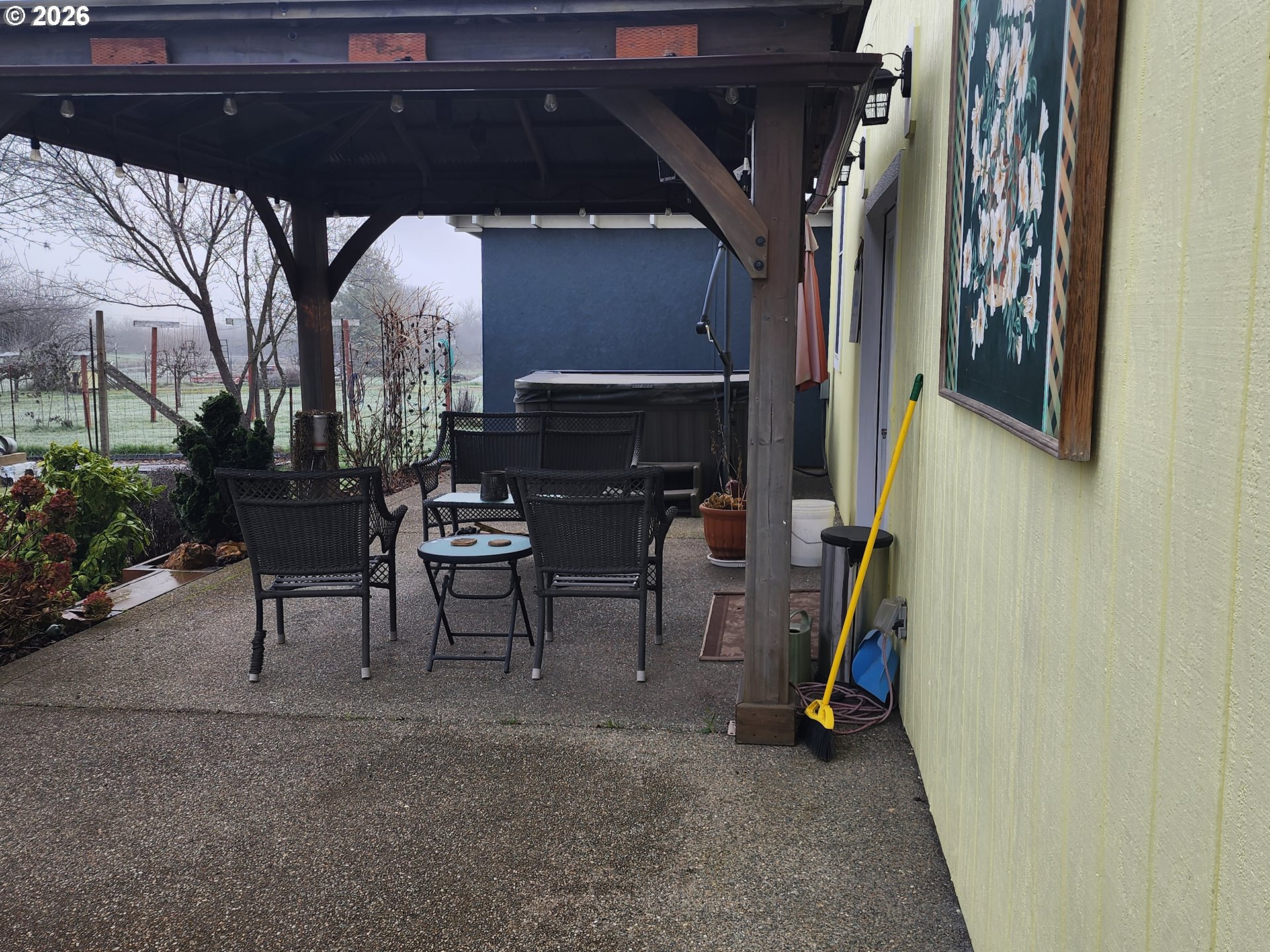 795 E Street Riddle, OR 97469 - Photo 15 of 40 a view of a porch with furniture and a gate
