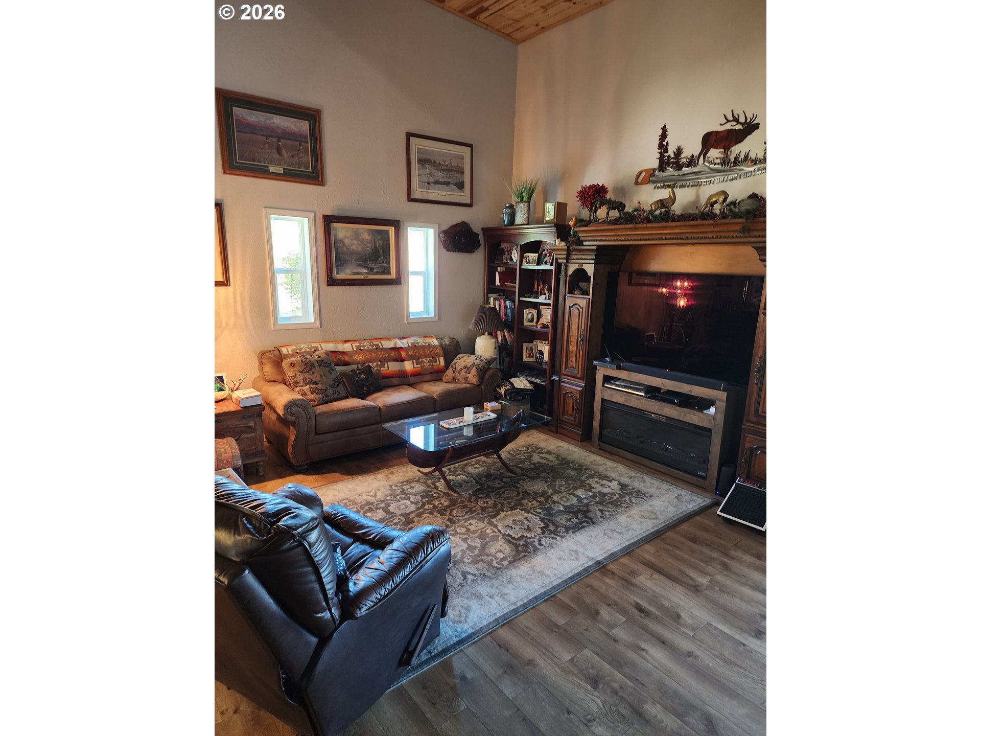 795 E Street Riddle, OR 97469 - Photo 25 of 40 a living room with furniture and a flat screen tv