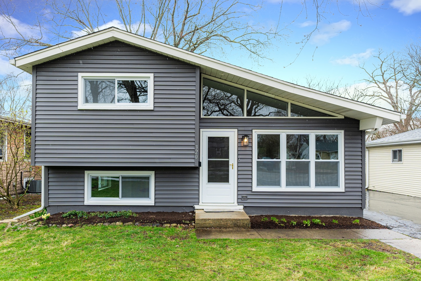 320 South Finley Road Lombard, IL 60148 - Photo 1 of 29 a front view of a house with a garden