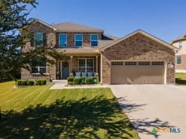 a front view of a house with swimming pool