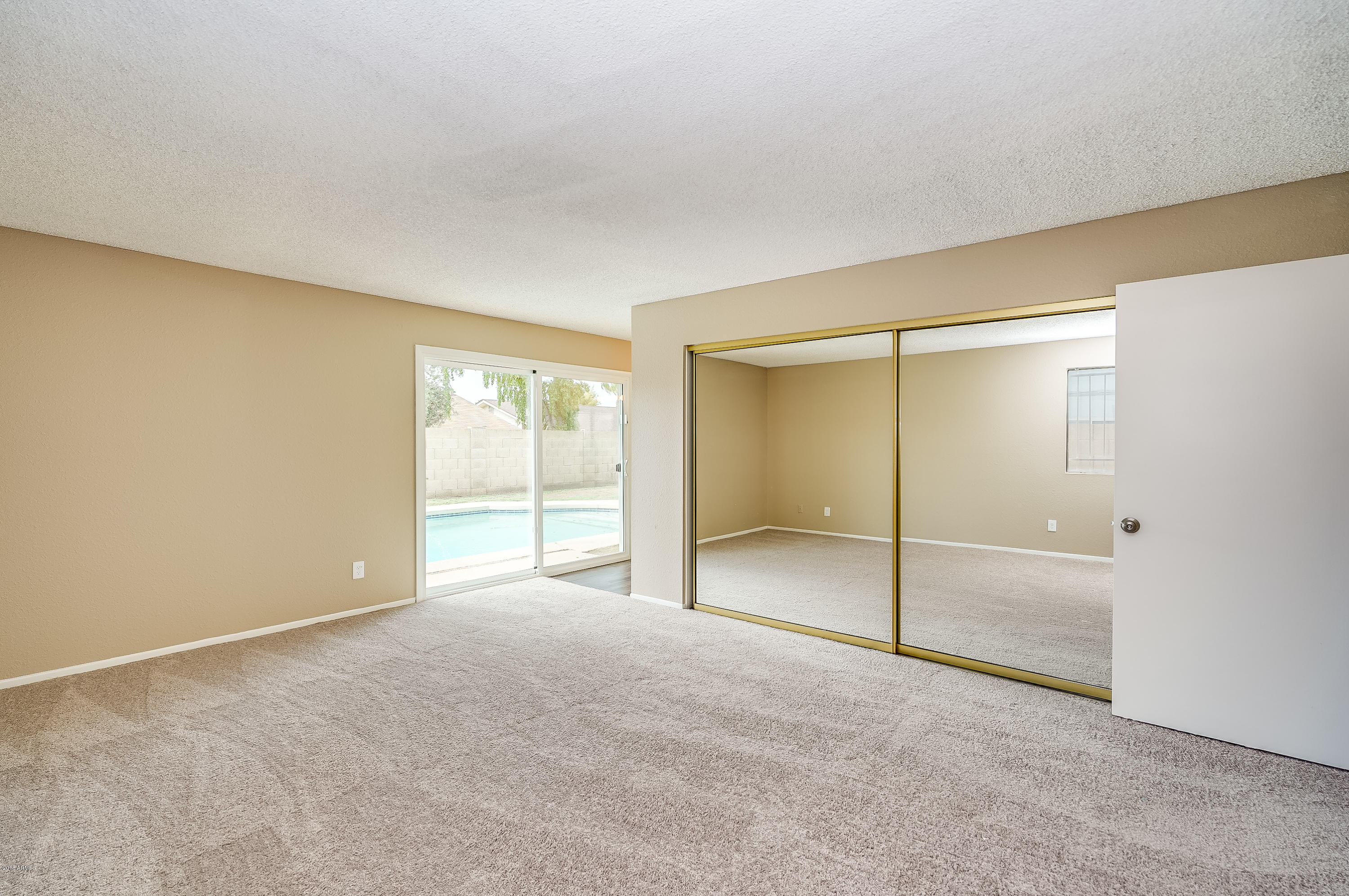 6509 West Camelback Road Phoenix, AZ 85033 - Photo 12 of 25 a view of an empty room with a window