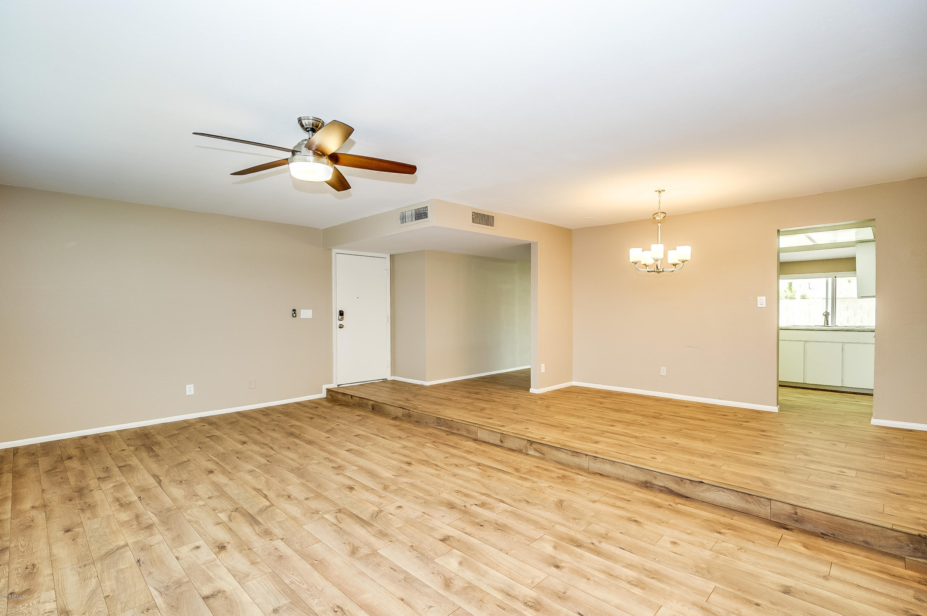 6509 West Camelback Road Phoenix, AZ 85033 - Photo 4 of 25 a view of an empty room and window