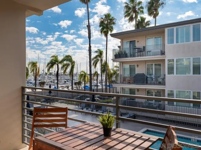 a view of a balcony with chairs