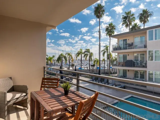 a view of a balcony with chairs